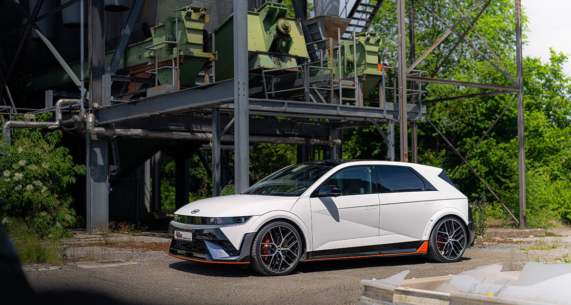 Still of a white Hyundai IONIQ 5 N in a industrial area