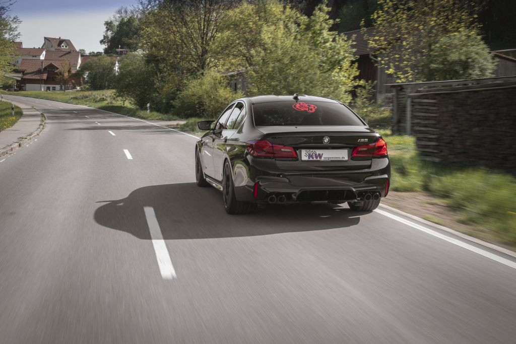 BMW M5 (F90) with KW coilover Variant 4 driving on the road.